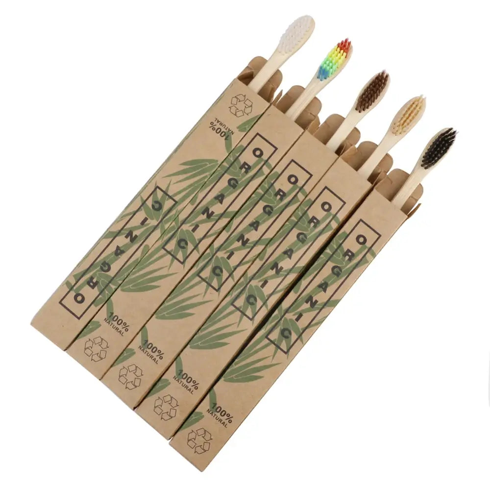 The bamboo toothbrush in 5 colours: White, colourful, coffee, beige and black in their packing. White background