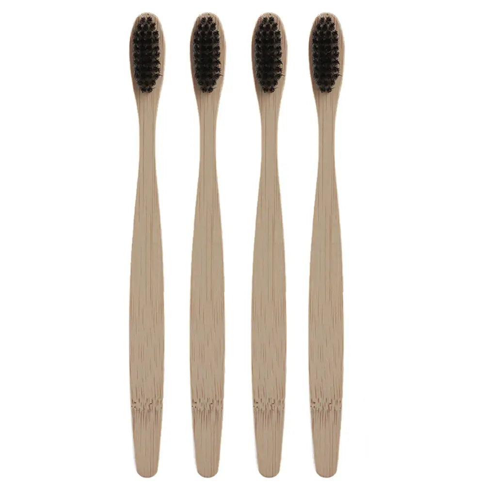 4 of the Black bamboo toothbrushes positioned vertically facing forward, with a white background.