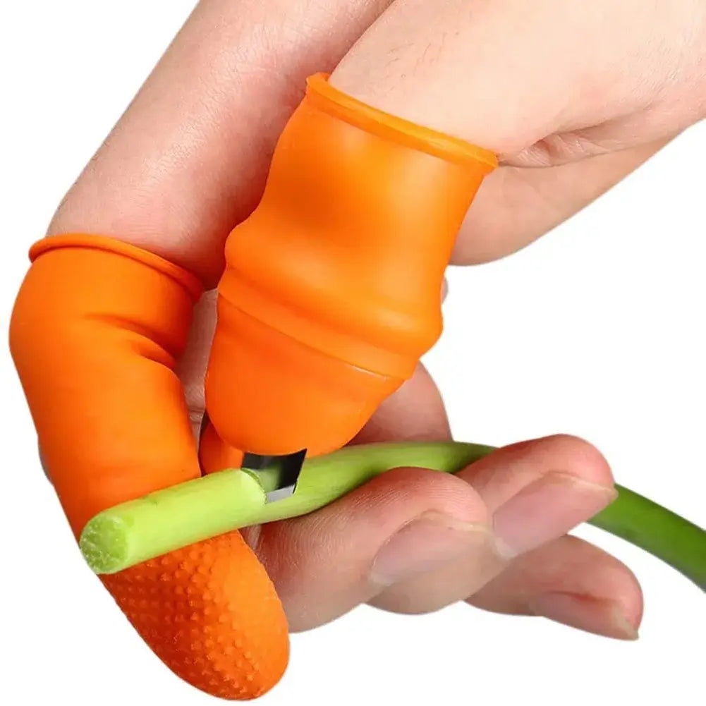 Someone using the The knife finger protector set to cut a spring onion with a white background