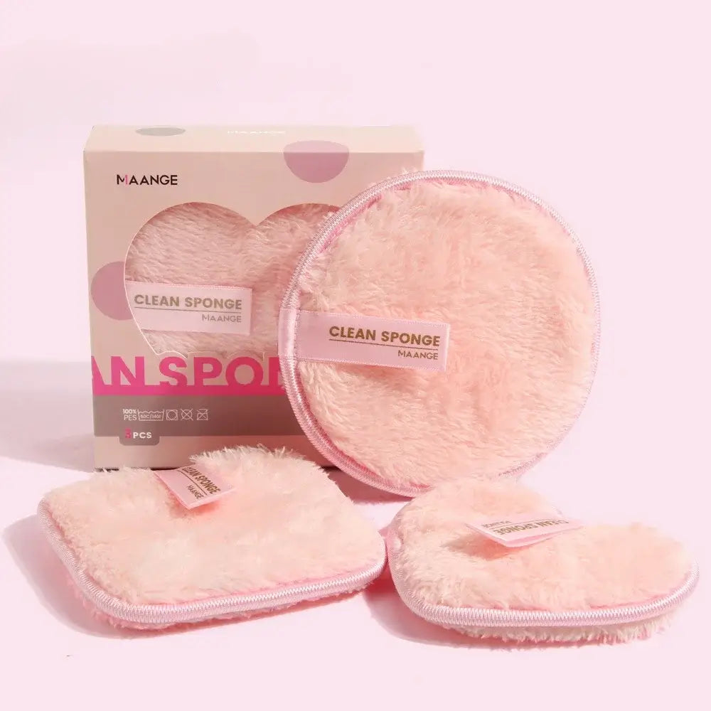 The washable makeup sponge packaging and the 3 reusable makeup remover pads In front with a pink background